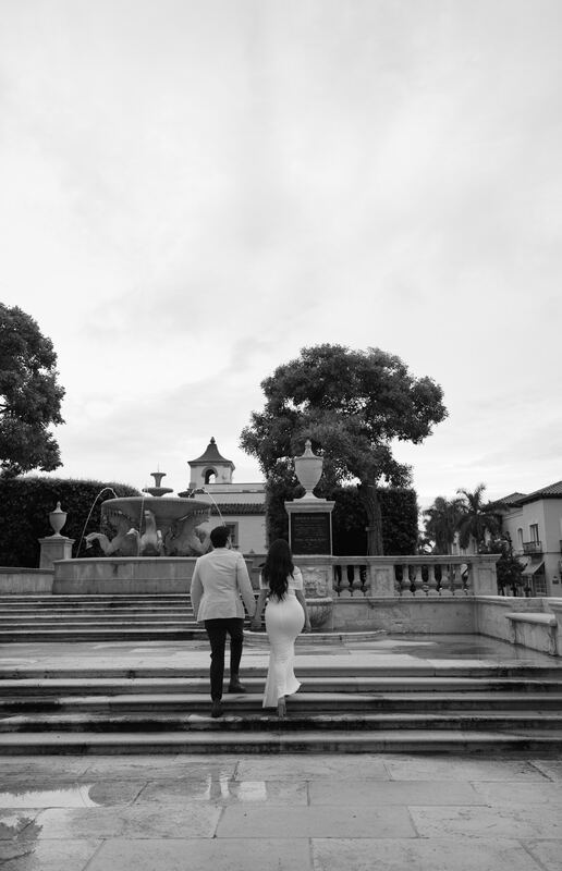 Black-and-white photo of Iviani and Joey descending garden steps