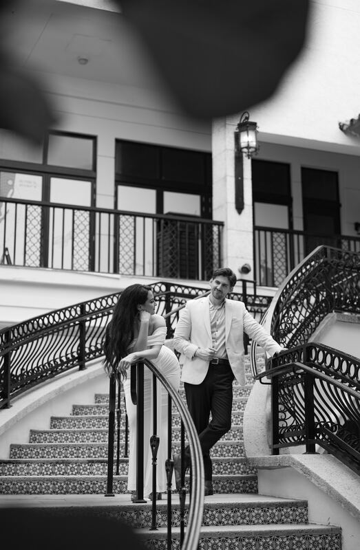 Black-and-white photo of Iviani and Joey on the staircase